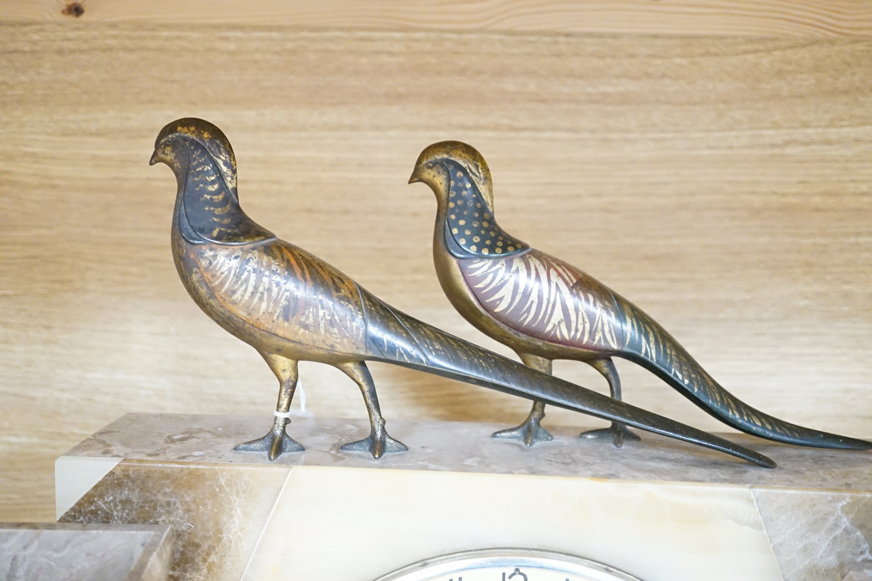 An Art Deco clock garniture, bronze mounted, signed segundo, with gilt bronze birds on top, height 34cm, length 55cm